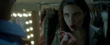 Movie still from “The Lure” (2015), directed by Agnieszka Smoczynska – A woman with blood on her face looking into a mirror; Close Up shot, Over the shoulder angle