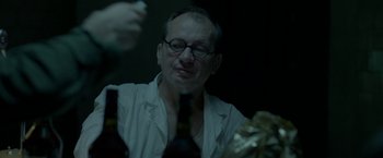 Movie still from “The Lure” (2015), directed by Agnieszka Smoczynska – An older man wearing a white shirt and a tie; Close Up shot, Over the shoulder angle