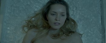 Movie still from “The Lure” (2015), directed by Agnieszka Smoczynska – A beautiful young woman laying in a pool of water; Close Up shot, Overhead angle