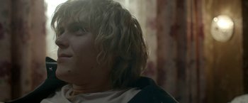 Movie still from “The Lure” (2015), directed by Agnieszka Smoczynska – A person with long blonde hair; Close Up shot, Over the shoulder angle
