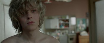 Movie still from “The Lure” (2015), directed by Agnieszka Smoczynska – A person's face in a kitchen; Close Up shot, Over the shoulder angle