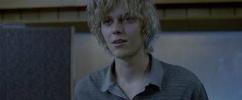 Movie still from “The Lure” (2015), directed by Agnieszka Smoczynska – A man with blonde hair and a gray shirt; Close Up shot, Over the shoulder angle