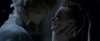 Movie still from “The Lure” (2015), directed by Agnieszka Smoczynska – A young man and a young woman looking into each others eyes; Close Up shot, Over the shoulder angle