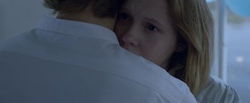 Movie still from “The Lure” (2015), directed by Agnieszka Smoczynska – A young girl is crying while hugging her mother; Close Up shot, Over the shoulder angle
