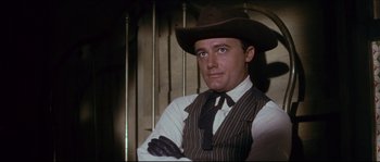 Movie still from “The Magnificent Seven” (1960), directed by John Sturges – A man wearing a cowboy hat and a vest; Close Up shot, Low angle