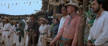 Movie still from “The Magnificent Seven” (1960), directed by John Sturges – A group of men standing next to each other in cowboy hats; Medium shot, Low angle