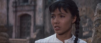 Movie still from “The Magnificent Seven” (1960), directed by John Sturges – A person wearing a white shirt; Close Up shot, Over the shoulder angle