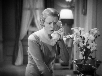 Movie still from “The Man Who Knew Too Much” (1934), directed by Alfred Hitchcock – An old photo of a woman talking on the phone; Close Up shot, High angle