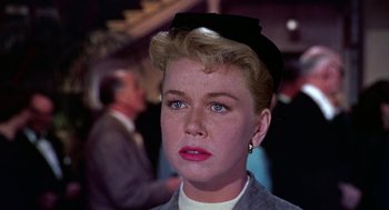 Movie still from “The Man Who Knew Too Much” (1956), directed by Alfred Hitchcock – A person wearing a hat; Close Up shot, Low angle
