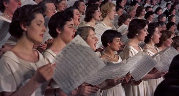 Movie still from “The Man Who Knew Too Much” (1956), directed by Alfred Hitchcock – A group of women singing in a choir; Medium shot, High angle