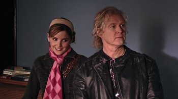 Movie still from “The Man from Earth” (2007), directed by Richard Schenkman – A man and a woman standing next to each other; Close Up shot, Over the shoulder angle