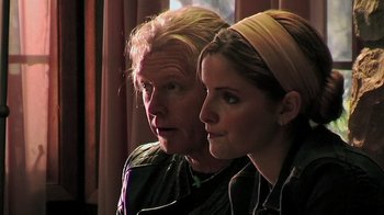Movie still from “The Man from Earth” (2007), directed by Richard Schenkman – A man and a woman sitting next to each other; Close Up shot, Over the shoulder angle