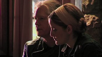 Movie still from “The Man from Earth” (2007), directed by Richard Schenkman – A man and a woman sitting next to each other; Close Up shot, Over the shoulder angle