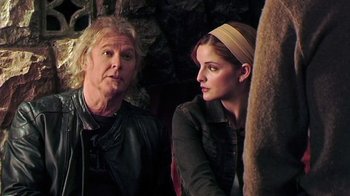 Movie still from “The Man from Earth” (2007), directed by Richard Schenkman – A man and a woman sitting next to each other; Close Up shot, Over the shoulder angle