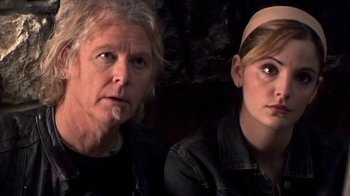 Movie still from “The Man from Earth” (2007), directed by Richard Schenkman – A man and a woman sitting next to each other; Close Up shot, Over the shoulder angle