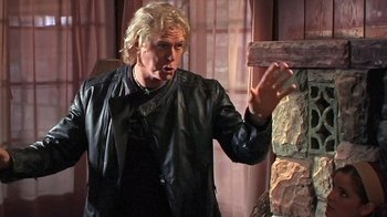 Movie still from “The Man from Earth” (2007), directed by Richard Schenkman – A man in a leather jacket standing in front of a wall; Close Up shot, Over the shoulder angle