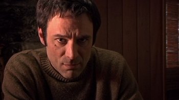 Movie still from “The Man from Earth” (2007), directed by Richard Schenkman – A person wearing a sweater; Close Up shot, Low angle