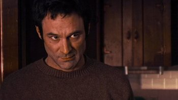 Movie still from “The Man from Earth” (2007), directed by Richard Schenkman – A person wearing a sweater; Close Up shot, Low angle