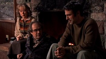 Movie still from “The Man from Earth” (2007), directed by Richard Schenkman – A group of people sitting in front of a fire place; Medium shot, Over the shoulder angle
