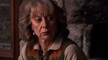 Movie still from “The Man from Earth” (2007), directed by Richard Schenkman – An older woman is looking down at the ground; Close Up shot, High angle