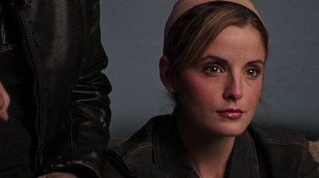 Movie still from “The Man from Earth” (2007), directed by Richard Schenkman – A person wearing a black jacket; Close Up shot, Over the shoulder angle