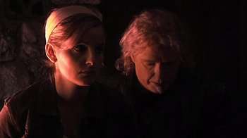 Movie still from “The Man from Earth” (2007), directed by Richard Schenkman – A man and a woman are looking at the camera; Close Up shot, Over the shoulder angle