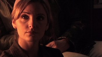 Movie still from “The Man from Earth” (2007), directed by Richard Schenkman – A woman's face in the dark; Close Up shot, Over the shoulder angle