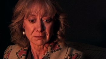 Movie still from “The Man from Earth” (2007), directed by Richard Schenkman – An older woman is looking down at her face; Close Up shot, Over the shoulder angle