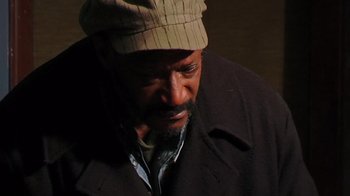 Movie still from “The Man from Earth” (2007), directed by Richard Schenkman – A man with a beard wearing a hat and a jacket; Close Up shot, High angle
