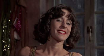 Movie still from “The Man with the Golden Gun” (1974), directed by Guy Hamilton – A person wearing a dress; Close Up shot, Low angle