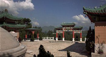 Movie still from “The Man with the Golden Gun” (1974), directed by Guy Hamilton – A view of an oriental garden with a view of the mountains in the background; Extreme Wide shot, High angle