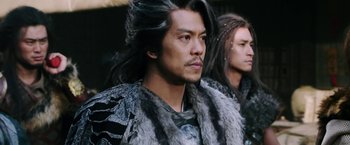 Movie still from “The Man with the Iron Fists” (2012), directed by RZA – A person with long black hair; Close Up shot, Low angle