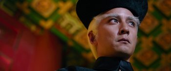 Movie still from “The Man with the Iron Fists” (2012), directed by RZA – A person wearing a hat; Close Up shot, Low angle