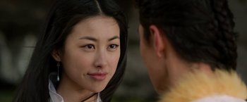 Movie still from “The Man with the Iron Fists” (2012), directed by RZA – A woman looking at a man in the mirror; Close Up shot, Over the shoulder angle