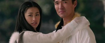 Movie still from “The Man with the Iron Fists” (2012), directed by RZA – A man and a woman pose for a picture; Close Up shot, Low angle