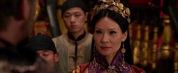Movie still from “The Man with the Iron Fists” (2012), directed by RZA – A woman in a purple dress and a man in a red suit; Close Up shot, Over the shoulder angle