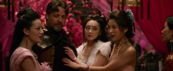 Movie still from “The Man with the Iron Fists” (2012), directed by RZA – A man and two women standing next to each other; Close Up shot, Over the shoulder angle