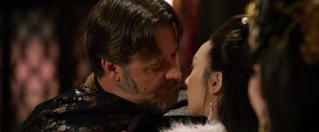 Movie still from “The Man with the Iron Fists” (2012), directed by RZA – A man and a woman kissing each other in front of a mirror; Close Up shot, Over the shoulder angle