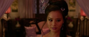 Movie still from “The Man with the Iron Fists” (2012), directed by RZA – A beautiful young woman with a butterfly hair clip; Close Up shot, Over the shoulder angle