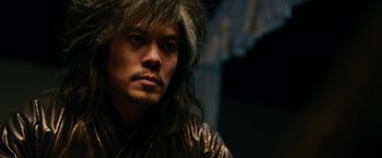 Movie still from “The Man with the Iron Fists” (2012), directed by RZA – A person wearing a wig; Close Up shot, Low angle