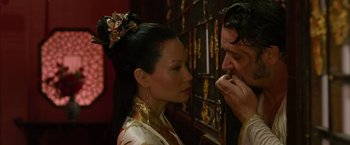 Movie still from “The Man with the Iron Fists” (2012), directed by RZA – A man and a woman looking at one another; Close Up shot, Over the shoulder angle