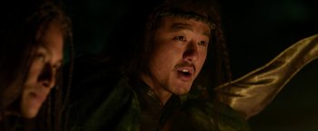 Movie still from “The Man with the Iron Fists” (2012), directed by RZA – A person with a beard; Close Up shot, Over the shoulder angle