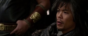 Movie still from “The Man with the Iron Fists” (2012), directed by RZA – A person wearing a costume; Close Up shot, Over the shoulder angle