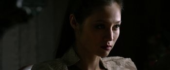 Movie still from “The Man with the Iron Fists” (2012), directed by RZA – A woman's face in the dark; Close Up shot, Over the shoulder angle