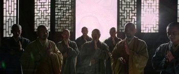 Movie still from “The Man with the Iron Fists” (2012), directed by RZA – A group of men standing next to each other in front of a window; Wide shot, Low angle