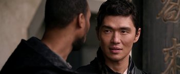 Movie still from “The Man with the Iron Fists” (2012), directed by RZA – Two men are looking at one another in the mirror; Close Up shot, Over the shoulder angle