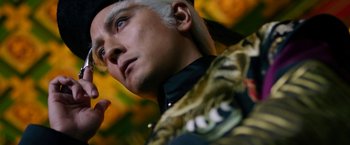 Movie still from “The Man with the Iron Fists” (2012), directed by RZA – A man's head and face; Close Up shot, Low angle