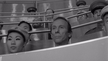 Movie still from “The Manchurian Candidate” (1962), directed by John Frankenheimer – Black and white photograph of a group of people in a stairwell; Medium shot, High angle