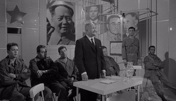 Movie still from “The Manchurian Candidate” (1962), directed by John Frankenheimer – A group of men sitting in front of a table; Wide shot, Low angle