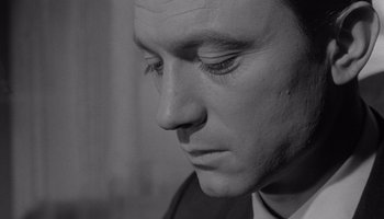 Movie still from “The Manchurian Candidate” (1962), directed by John Frankenheimer – Black and white photograph of a man's face; Close Up shot, High angle